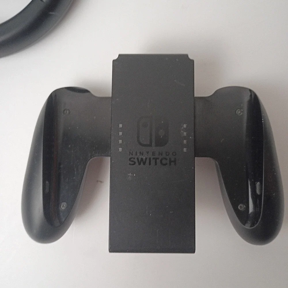 Nintendo Switch Game Accessories: 1 Steering Wheel and 2 Controller Grips